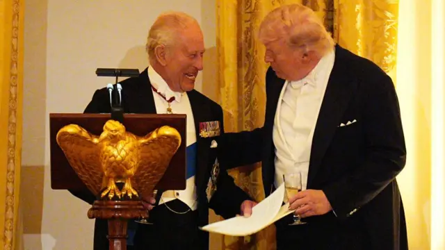 Charles laughs with Trump