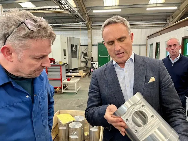 Alex Cole-Hamilton looking at a precision engineered part for hydraulic pump made at Abbey Tools in Kelso