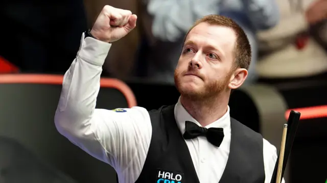 Mark Allen celebrates
