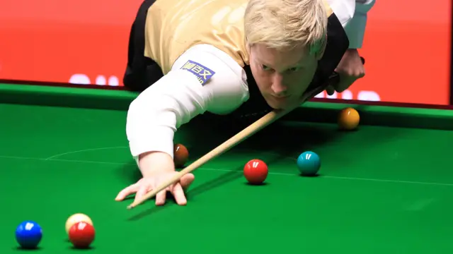 Neil Robertson plays a shot