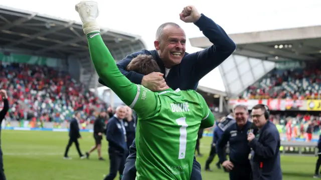 Dungannon manager Rodney McAree and goalkeeper Declan Dunne celebrate after they win the Irish Cup final on penalties