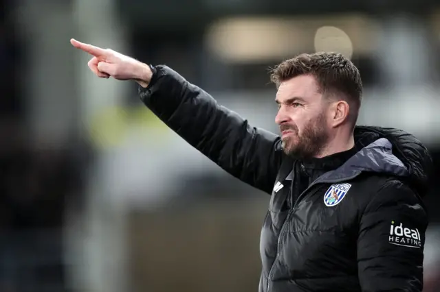 West Bromwich Albion interim head coach James Morrison points his finger to signal to his players