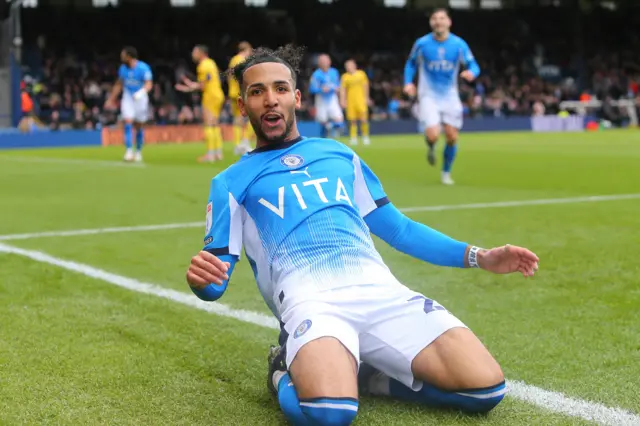Odin Bailey celebrates giving Stockport the lead against Wycombe