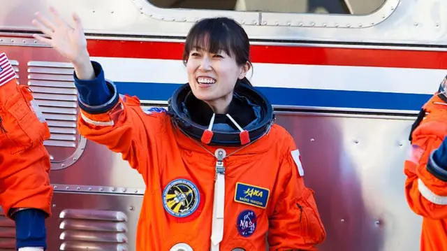 Naoko Yamazaki in her orange space suit