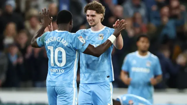 Jack Rudoni embraces Ephron Mason-Clark at full-time