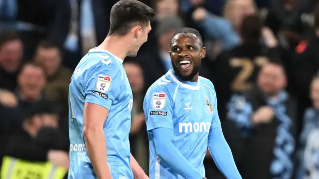 Frank Onyeka shares a smile with team-mate Bobby Thomas
