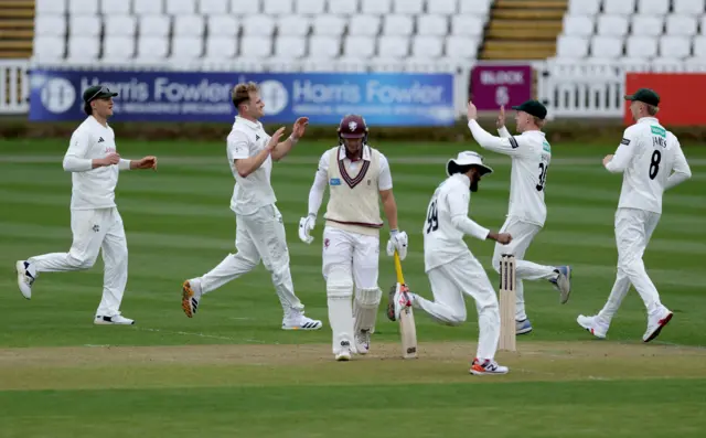 Dillon Pennington takes a wicket for Notts