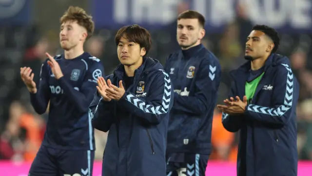 Coventry players applaud the travelling fans after the 3-0 win at Swansea on 21 March
