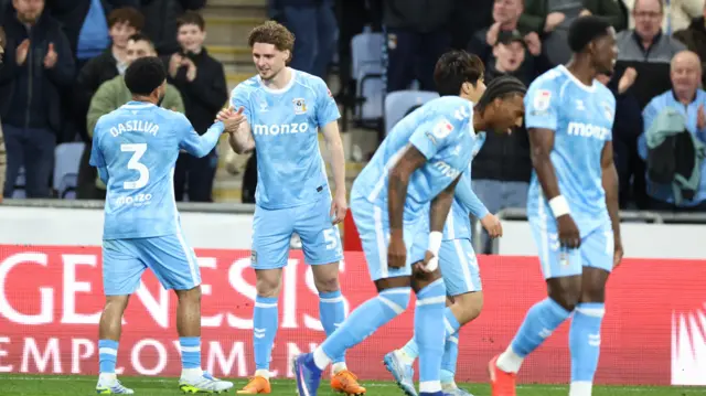 Jay Dasilva celebrates with Coventry goalscorer Jack Rudoni