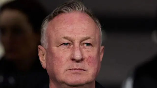 Michael O'Neill, while managing Northern Ireland, looking on towards the pitch before kick-off against Italy.