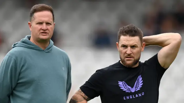 Rob Key and Brendon McCullum watch an England training session
