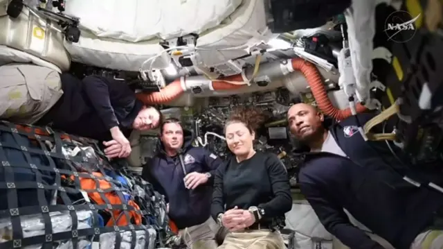 astronauts in the capsule.