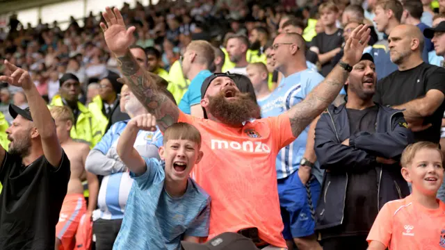 Coventry fans celebrate their win at Pride Park