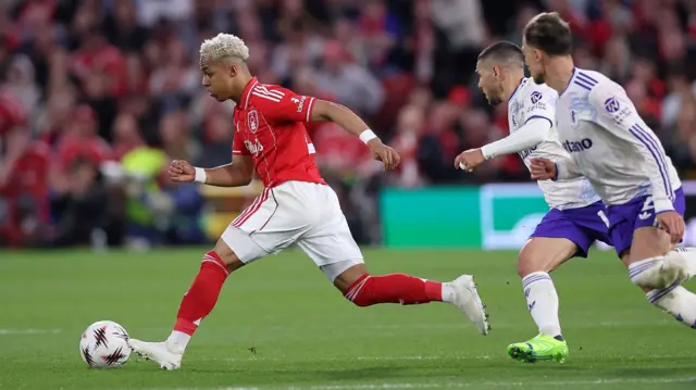 Nottingham Forest's Omari Hutchinson (L) in action