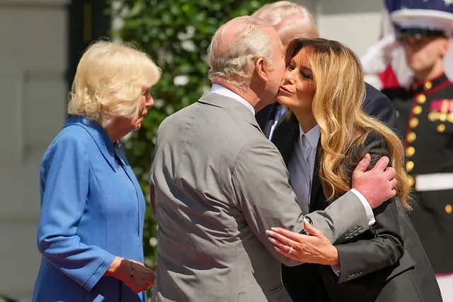 King Charles III embraces first lady Melania Trump before departing a farewell ceremony at the White House on the final day of the state visit