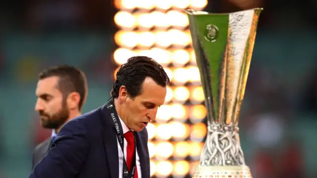 Arsenal manager Unai Emery walks past the trophy following the UEFA Europa League Final between Chelsea and Arsenal