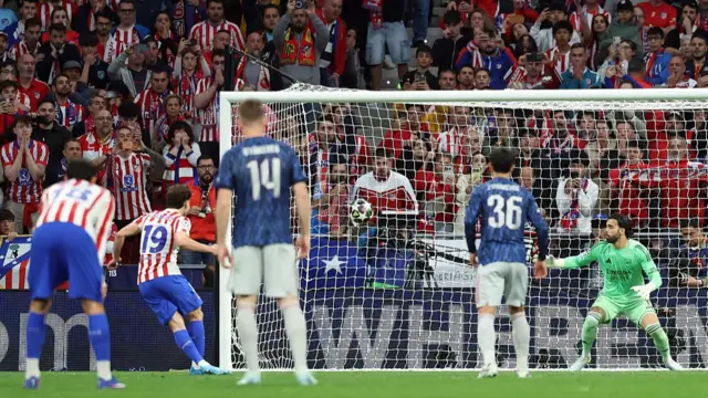 Julian Alvarez scores a penalty