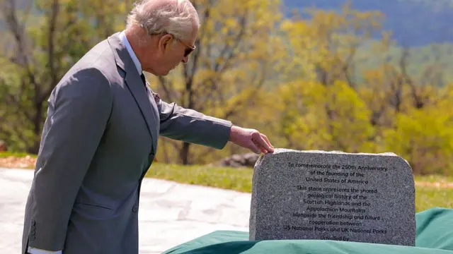 King Charles unveils a commemorative stone