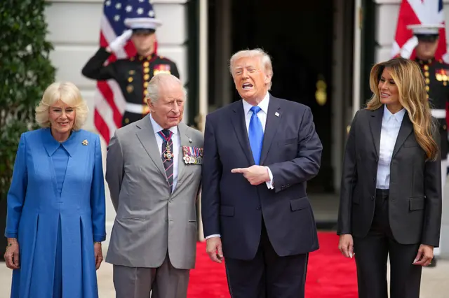 Queen Camilla, King Charles III, President Donald Trump and First Lady Melania Trump stand on a red carpet outside the South Portico of the White House