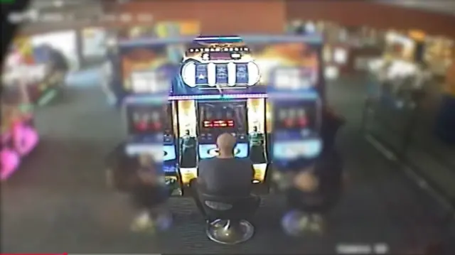 A man at an arcade.