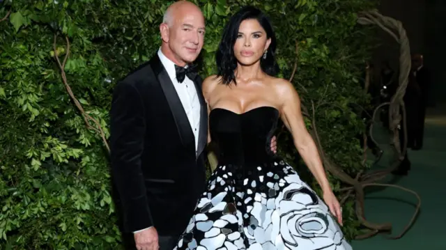 Jeff Bezos and Lauren Sanchez pose on the Met Gala carpet in 2024