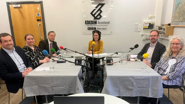The Aberdeen Deeside and North Kincardine constituency candidates round a table with host Rebecca Curran