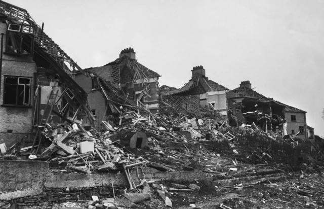 Plymouth devastated by a series of heavy raids on the city and the naval dockyards at Devonport in March - April 1941. The black and white image shows a series of collapsed homes.