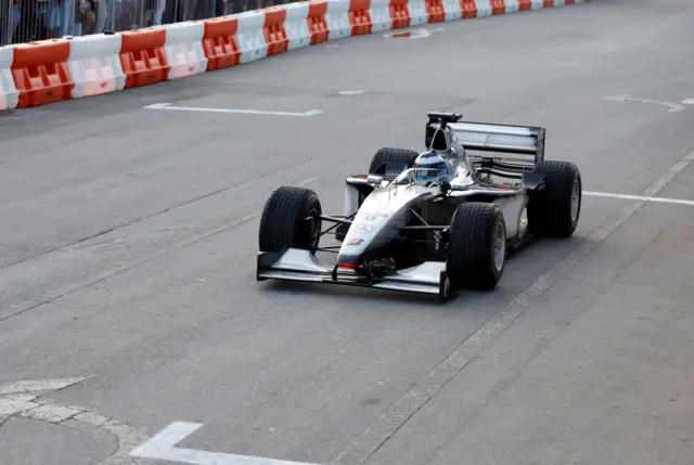Mika Hakkinen drives his championship-winning McLaren MP4/14 from 1999 in Regatta Harbour in Coconut Grove in Miami