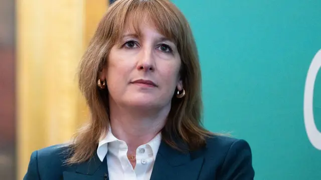 A file photo of Reeves, sitting on stage at an event