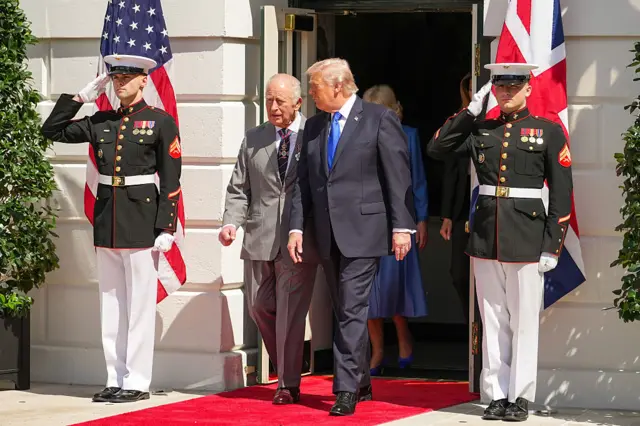 Trump and the King walk out of the White House