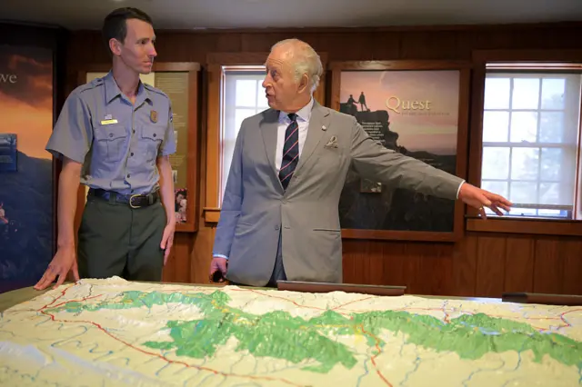 King looks over a map of Shenandoah National Park