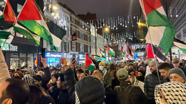 Pro-Palestine protesters march down Oxford Street in December 2025
