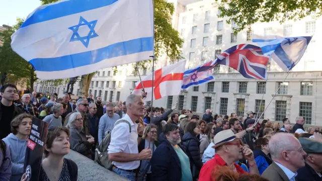 People attend a Campaign Against Antisemitism 'national emergency' rally in Whitehall, central London, following two people being stabbed in Golders Green, north-west London on Wednesday.