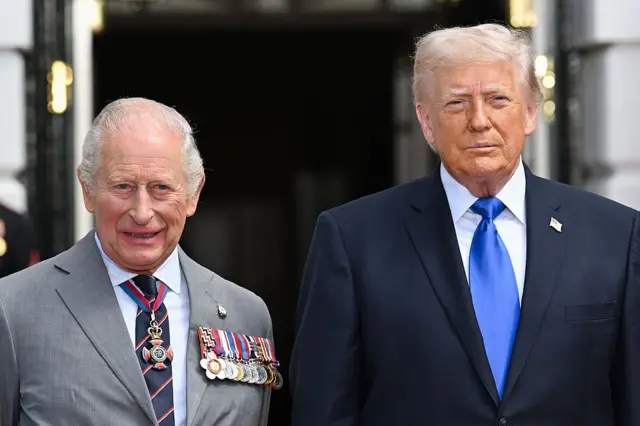 The King and Trump stand next to one another