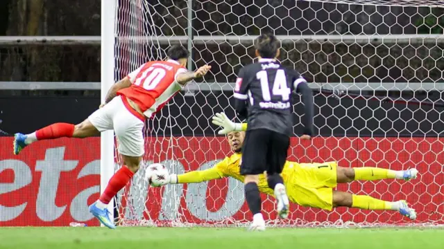 Goalkeeper Noah Atubolu of SC Freiburg with a save