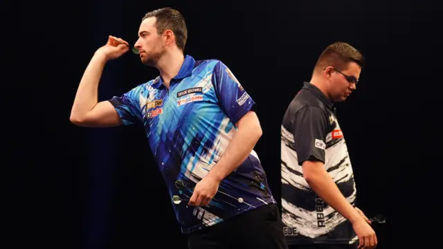Luke Humphries (left) during his semi-final match against Gian van Veen on night thirteen of the BetMGM Premier League 2026 at P&J Live, Aberdeen