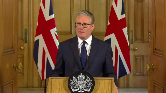 Keir Starmer speaking at a lectern.