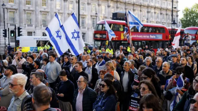 A crowd of people demonstrating outside Downing Street.