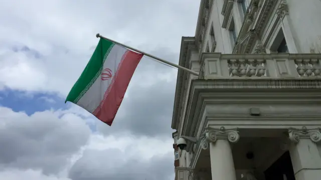 Iranian flag on the embassy of the Islamic Republic of Iran in London