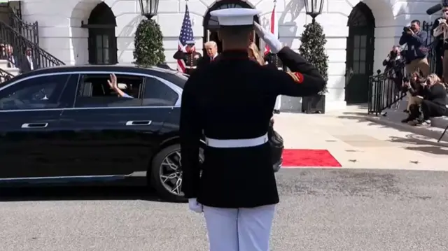 the royals driving off in a car as melania and donald trump say goodbye