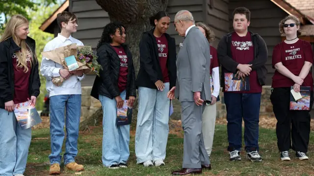 King greets a group of high school students