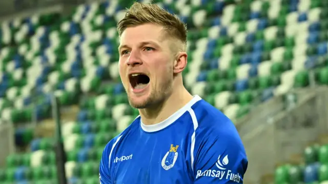 Andy Mitchell celebrates