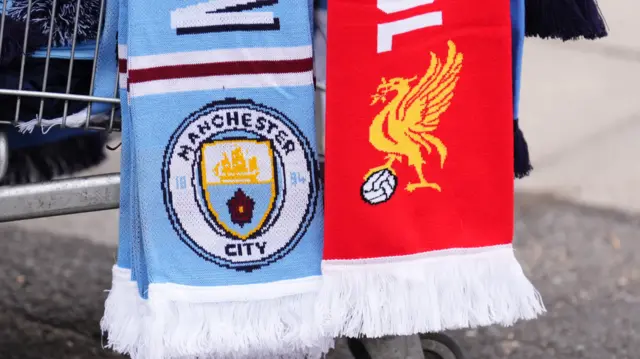 Manchester City scarf next to Liverpool scarf