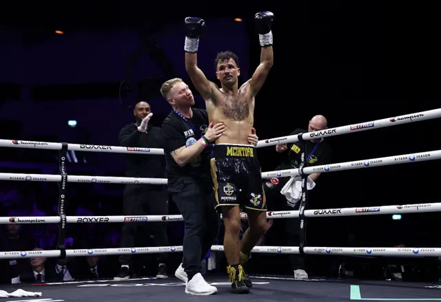 Morgan McIntosh holds up his arms