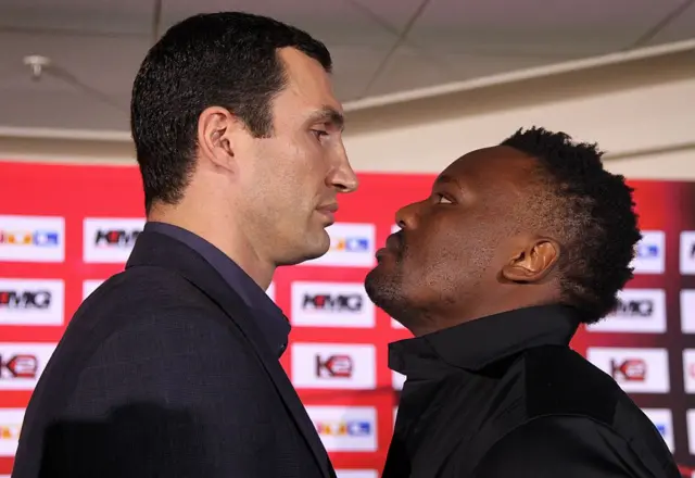 Vitali Klitschko stares at Derek Chisora