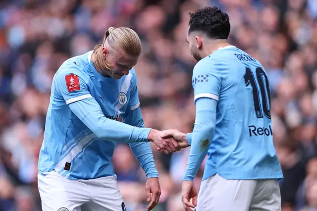 Erling Haaland and Rayan Cherki