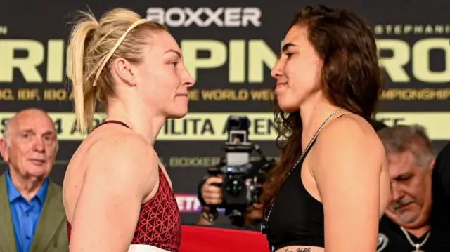 Lauren Price and Stephanie Pineiro stand face-to-face