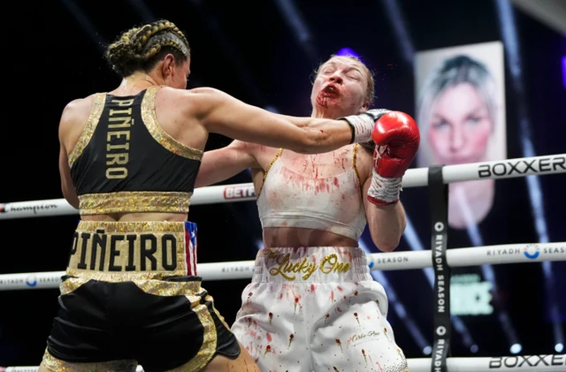 Stephanie Pineiro punches a very bloodied Lauren Price