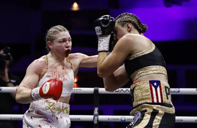 Blood pours from the mouth of Lauren Price's mouth