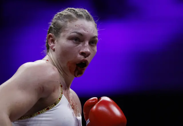 Blood pours from the mouth of Lauren Price